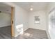 Small bedroom with gray vinyl flooring and a window at 281 Grove Rd, Venice, FL 34293