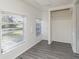 Bright bedroom with gray vinyl flooring and large windows at 281 Grove Rd, Venice, FL 34293