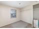 Cozy bedroom with a window and wall-mounted shelving at 281 Grove Rd, Venice, FL 34293