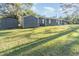 House exterior showcasing a large backyard and shed at 281 Grove Rd, Venice, FL 34293