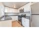 Bright kitchen with stainless steel appliances and granite countertops at 281 Grove Rd, Venice, FL 34293