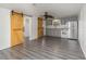 Open concept kitchen with gray cabinets and stainless steel appliances at 281 Grove Rd, Venice, FL 34293