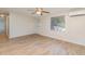 Living room with light wood flooring, ceiling fan, and window at 281 Grove Rd, Venice, FL 34293