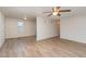 Open living area with light flooring and ceiling fan at 281 Grove Rd, Venice, FL 34293