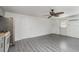 Living room with vinyl flooring and sliding barn door at 281 Grove Rd, Venice, FL 34293