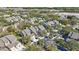 Aerial view of community with houses, trees, and a pool at 3079 Landmark Blvd # 1606, Palm Harbor, FL 34684