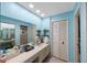 Bathroom with a double vanity and a walk-in shower at 3079 Landmark Blvd # 1606, Palm Harbor, FL 34684