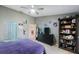 Bedroom with a bookcase, dresser and a purple bed at 3079 Landmark Blvd # 1606, Palm Harbor, FL 34684