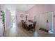 Bright dining room with wooden table and light walls at 3079 Landmark Blvd # 1606, Palm Harbor, FL 34684