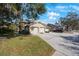 Two-story condo with attached garage and landscaped grounds at 3079 Landmark Blvd # 1606, Palm Harbor, FL 34684