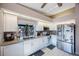 Modern kitchen boasting ample cabinet space and granite countertops at 3079 Landmark Blvd # 1606, Palm Harbor, FL 34684