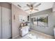 Bright kitchen with white cabinets and a window overlooking the backyard at 3079 Landmark Blvd # 1606, Palm Harbor, FL 34684