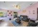 Living room features gray sofas and a ceiling fan at 3079 Landmark Blvd # 1606, Palm Harbor, FL 34684