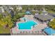 Community pool area with multiple gazebos and lounge chairs at 3079 Landmark Blvd # 1606, Palm Harbor, FL 34684