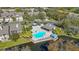 Community pool with a large deck and gazebo at 3079 Landmark Blvd # 1606, Palm Harbor, FL 34684