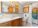 Bathroom featuring new wood cabinets, fresh paint, and a unique glass shower at 3235 Merita Dr, Holiday, FL 34691