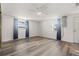 Well-lit bedroom featuring new wood floors, fresh paint and a large window for natural light at 3235 Merita Dr, Holiday, FL 34691