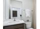 Modern bathroom with single vanity, quartz countertop, and shower at 32465 Osprey Peak Way, San Antonio, FL 33576