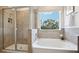 Spa-like bathroom with soaking tub and walk-in shower at 32465 Osprey Peak Way, San Antonio, FL 33576