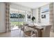 Bright dining room with sliding glass doors to backyard at 32465 Osprey Peak Way, San Antonio, FL 33576