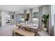 Bright dining room with sliding glass doors and a wooden table at 32474 Osprey Peak Way, San Antonio, FL 33576