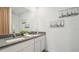 Double sink bathroom with gray countertop and white cabinets at 33217 Osprey Peak Way, San Antonio, FL 33576