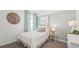 Light and airy bedroom with neutral bedding and window at 33217 Osprey Peak Way, San Antonio, FL 33576