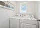 Laundry room with side-by-side washer and dryer at 33217 Osprey Peak Way, San Antonio, FL 33576