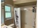 Bright bathroom with shower/tub and window at 3544 Snowy Egret Ct, Palm Harbor, FL 34683