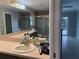 Bathroom with double vanity and view of pool at 3544 Snowy Egret Ct, Palm Harbor, FL 34683