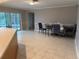 Casual dining area with sliding doors to the pool at 3544 Snowy Egret Ct, Palm Harbor, FL 34683