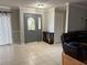 Inviting entryway with tiled floors and a gray front door at 3544 Snowy Egret Ct, Palm Harbor, FL 34683