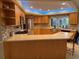 Bright kitchen with an island and under-cabinet lighting at 3544 Snowy Egret Ct, Palm Harbor, FL 34683