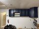 Dark blue kitchen cabinets installed along a wall at 3544 Snowy Egret Ct, Palm Harbor, FL 34683