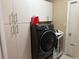 Laundry room with washer, dryer, and ample storage at 3544 Snowy Egret Ct, Palm Harbor, FL 34683