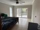 Bedroom with sliding door access to the pool at 3544 Snowy Egret Ct, Palm Harbor, FL 34683