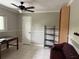 Spacious office with a comfortable couch and built-in shelving at 3544 Snowy Egret Ct, Palm Harbor, FL 34683