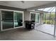 Outdoor patio with grill and sliding glass doors at 3544 Snowy Egret Ct, Palm Harbor, FL 34683