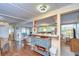 Open concept dining area with breakfast bar and hardwood floors at 37350 Tropical Dr, Zephyrhills, FL 33541