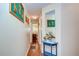 Bright hallway with hardwood floors and decorative accents at 37350 Tropical Dr, Zephyrhills, FL 33541