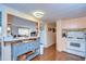 View of kitchen with light peach cabinets and a breakfast bar at 37350 Tropical Dr, Zephyrhills, FL 33541