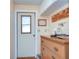 Laundry area with wooden dresser and storage cabinets at 37350 Tropical Dr, Zephyrhills, FL 33541