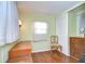 Home office with wood desk and chair, featuring wood floors at 37350 Tropical Dr, Zephyrhills, FL 33541