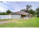 Backyard with patio, shade sail, and grassy area at 38902 Inez Ave, Zephyrhills, FL 33542