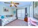 Bedroom with daybed and ceiling fan at 38902 Inez Ave, Zephyrhills, FL 33542