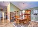 Bright dining room with hardwood floors and wooden furniture at 38902 Inez Ave, Zephyrhills, FL 33542