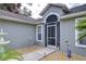 Front entry with walkway, fountain, and screen door at 38902 Inez Ave, Zephyrhills, FL 33542