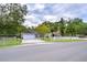 House exterior with driveway and white fence at 38902 Inez Ave, Zephyrhills, FL 33542