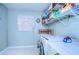 Clean laundry room with washer, dryer, and storage at 38902 Inez Ave, Zephyrhills, FL 33542