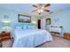 Bright and airy main bedroom with a king-size bed at 38902 Inez Ave, Zephyrhills, FL 33542